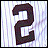 A pixelated dark brown number 2 on a light purple and white striped background with subtle vertical lines.