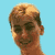 Pixelated static image of a person's head and neck against light blue background with visible dithering and color blending in hair and skin tones.