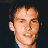 A pixelated image of a person with short dark hair against a black background, next to green text reading 'Original Icons .com' on a solid green backdrop.