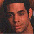 A 50x50 pixel buddy icon split into two sections: a partial human face on the left and green text reading "Original Icons .com" on the right against a dark background.