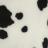 Pixelated black shapes on a light background with no discernible text or recognizable forms.