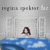 Pixelated image shows a figure with brown hair standing in blue water between two white structures under a gray sky.
