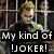 Pixelated image of a person with light brown hair behind metal bars, wearing dark clothing and green accents, with text overlay reading "My kind of JOKER!".