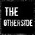 Black square icon with white pixelated text reading 'THE OTHERSIDE' in two lines, framed by a gray border.