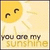 A pixelated yellow sun with closed eyes and a smile appears above text reading "you are my sunshine" on a light beige background.