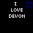 Black background with white pixelated text "I LOVE DEVON" and a blue heart symbol above the left side of the text.