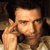 Static pixelated image of a man's face and upper body with hand near ear, likely from an old AIM buddy icon set.
