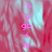 Pixelated pink text 'b g gb + m' vertically aligned on a red and cyan abstract background with a gray rectangular overlay.