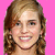 pixelated images shows a woman with light brown curly hair against a solid pink background, each frame displaying different facial expressions and overlaid text