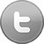 A circular gray icon with a white lowercase 't' symbol centered on a gradient background.