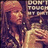 A pixelated image of a person with long hair holding their chest, displaying text that changes from 'DON'T TOUCH MY' to 'MY DIRT!'