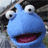 Static 48x48 pixel icon of a blue cartoon character with large white eyes, black pupils, and an open mouth showing pink tongue and dark interior.