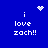 Blue background with white pixelated text 'i love zach!!' and animated heart or starburst symbols above the text.