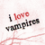 A static image with text 'I love vampires' in red and black on a light background, alongside a colorful striped pattern with the words 'what obsession?' visible.