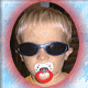 A child with blonde hair wears dark sunglasses and a white pacifier with red ring, positioned next to German text asking if eyes can lie.