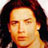 Static 48x48 pixel icon showing a close-up of a person's face with long dark hair, rendered in warm orange and yellow tones against a black background.