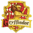 A golden shield-shaped icon with red accents and a central figure holding a golden object, featuring the text 'Grylladre' on a banner below.