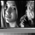 Black-and-white animated sequence showing a person with long hair and another figure in the background, with changing text overlays on gray bars.