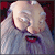 Pixelated Santa Claus face with closed eyes, white beard, red lips, and gray background text reading BLU-RAY™ & 2 DISC DVD AUG 26