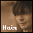 A pixelated image of a person with dark hair and light skin, featuring text 'Hair' in white with varying color accents across frames.