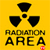 Yellow background with black radiation symbol and text reading RADIATION AREA in pixelated font.