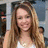 A pixelated image of a person with long light brown hair wearing a white top, next to text reading 'Miley Cyrus <3' on a dark blue background.