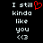 Two side-by-side pixelated text on black background, each displaying "I still kinda like you <3" with left featuring red heart symbol replacing "love"