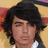 Pixelated image of a person with dark hair and light skin on the left, next to pink with white text reading "BURNIN' UP FOR JOE JONAS!"