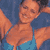 Pixelated static image of a person in a bikini top against a blue background with orange and brown tones.