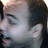A pixelated image of a person's face with red text 'Love' and a red arrow symbol on white background.