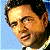 A pixelated contact sheet showing two frames of an animated icon featuring a man's face on the left and green text reading "Original Icons .com" on the right against a dark background.