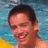 A pixelated image of a person with short dark hair smiling in a pool, next to blue text reading "I Love JT So Much... He Is So Cute..." on a light blue background.