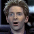 Pixelated close-up of a person with light brown hair, open mouth showing teeth and tongue, blue eyes, dark background with blurred lights.