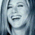 A pixelated image of a person with light hair smiling, next to green text reading 'Original Icons .com' on a dark background.