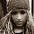 Static 50x50 pixel icon showing a person with long light-colored hair wearing a dark hat, rendered in low-resolution grayscale tones with visible dithering and pixelation.