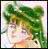 Pixelated image of a figure with green foliage above, light-colored clothing, and a blurred background with soft pastel tones.
