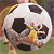 Static 50x50 pixel icon showing a soccer ball with a yellow stick figure running on it, set against a blurred background of green and brown tones.