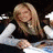 A blonde woman in a black top and white long sleeves appears in three distinct poses across the image sequence.