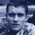 Static 50x50 pixel buddy icon showing a stylized grayscale portrait of a person with short dark hair and visible facial features against a blue-toned background.
