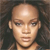 Pixelated close-up of a person with a bald head, light skin, and dark eyes against a dark background.