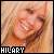 Pixelated close-up of a person's face with light brown hair, showing a smiling expression and visible beard stubble, with text reading 'HILARY' at the bottom.