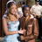 Pixelated image of two people embracing, one in a white dress, on a cyan background with red text.