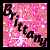 A pixelated image with pink and white speckled background, black text reading 'Brittany' diagonally across the center.