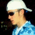 A pixelated buddy icon featuring a person in profile on the left and green text reading "Original Icons .com" on the right against a dark background.