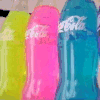 Animated sequence of repeating Coca-Cola bottle icons in blue, pink, and yellow with changing text labels beneath them.