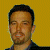 A pixelated image of a person with short dark hair against a yellow background, next to green text reading 'Original Icons .com' on a dark green backdrop.
