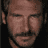 Static 48x48 pixel icon showing a close-up of a man's face with brown skin tone, mustache, and beard stubble against dark background.