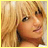 Static 48x48 pixel buddy icon with yellow border showing a close-up of a person's face and shoulder against a blurred background, rendered in low-resolution pixel art style.