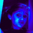 Pixelated blue-toned image of a stylized face with glowing eyes and mouth against dark background, framed by vertical cyan and purple bars.