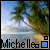A beach scene with palm trees and water, featuring the name 'Michelle' in pixelated text below.